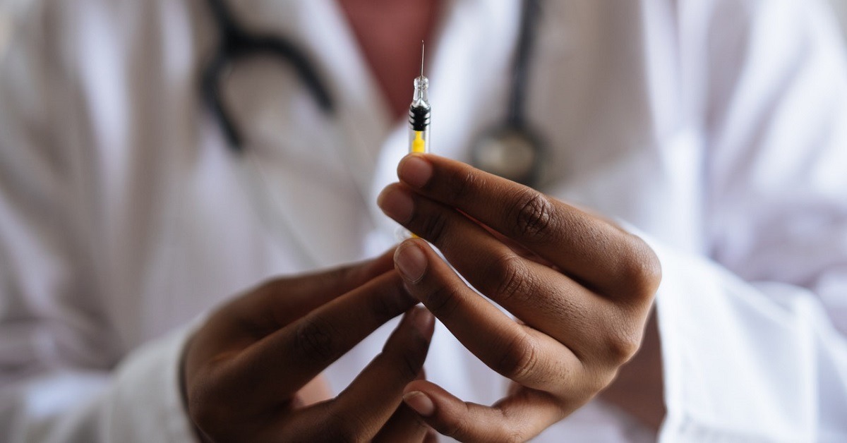 A pharmacist holding a tetanus vaccine 